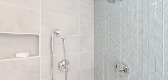 Fresh luxury shower with green glass tile wall